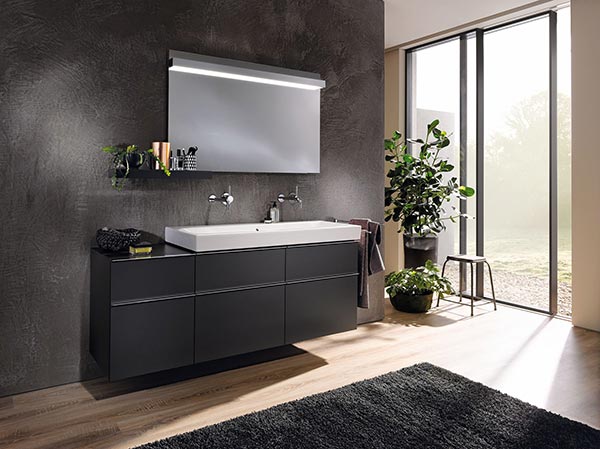 A1 Bathrooms and Kitchens. Contemporary bathroom with floating vanity and natural light.